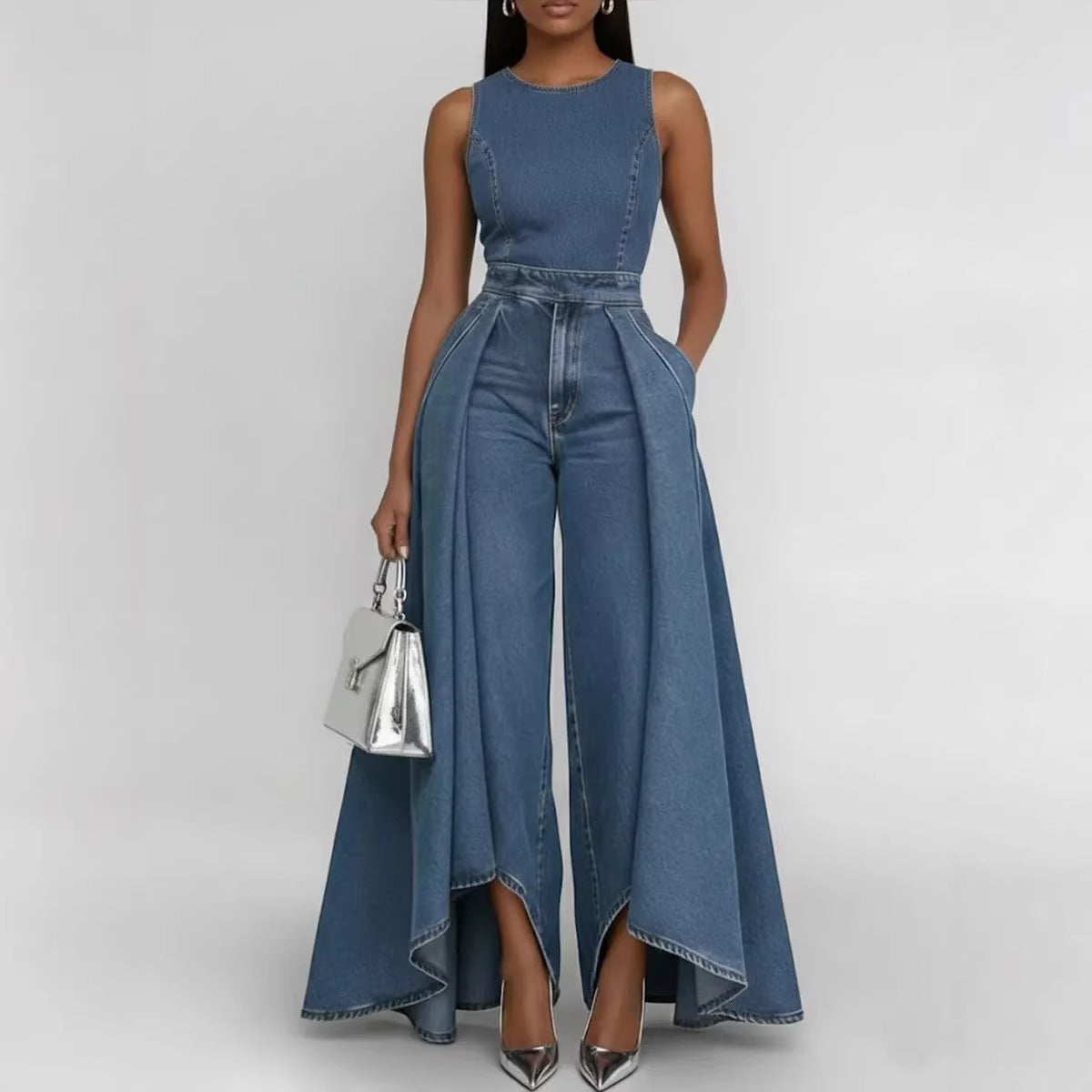 Woman wearing a blue denim jumpsuit on a white background
