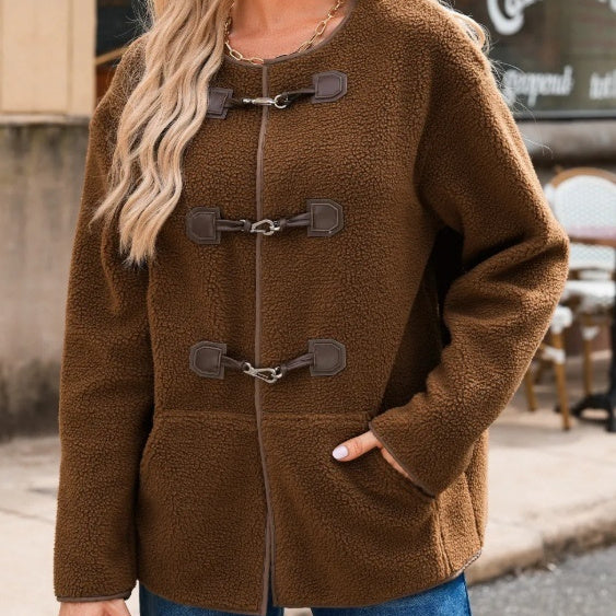 Brown fleece jacket with duffle coat style on a blurred street background