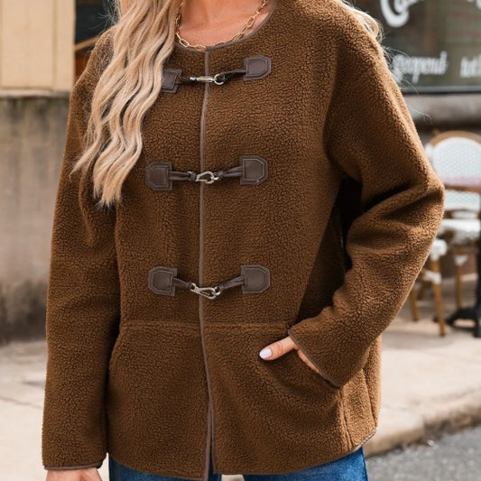 Brown fleece jacket with duffle coat style on a blurred street background