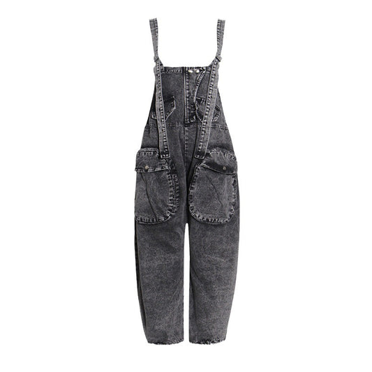 Black denim overalls on a white background