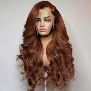 Brown wig on a mannequin head against a plain background