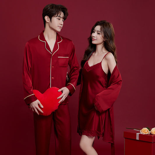 Man and woman in red pajamas with a heart-shaped pillow on a red background
