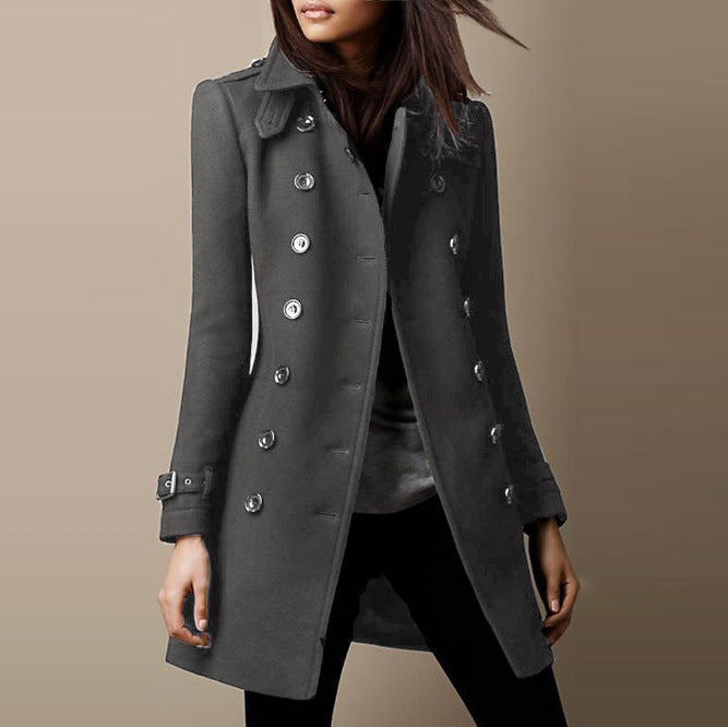 Gray coat worn by a person on a beige background