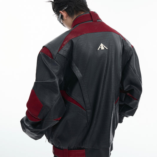 Person wearing a black and red jacket with a logo on the back against a white background
