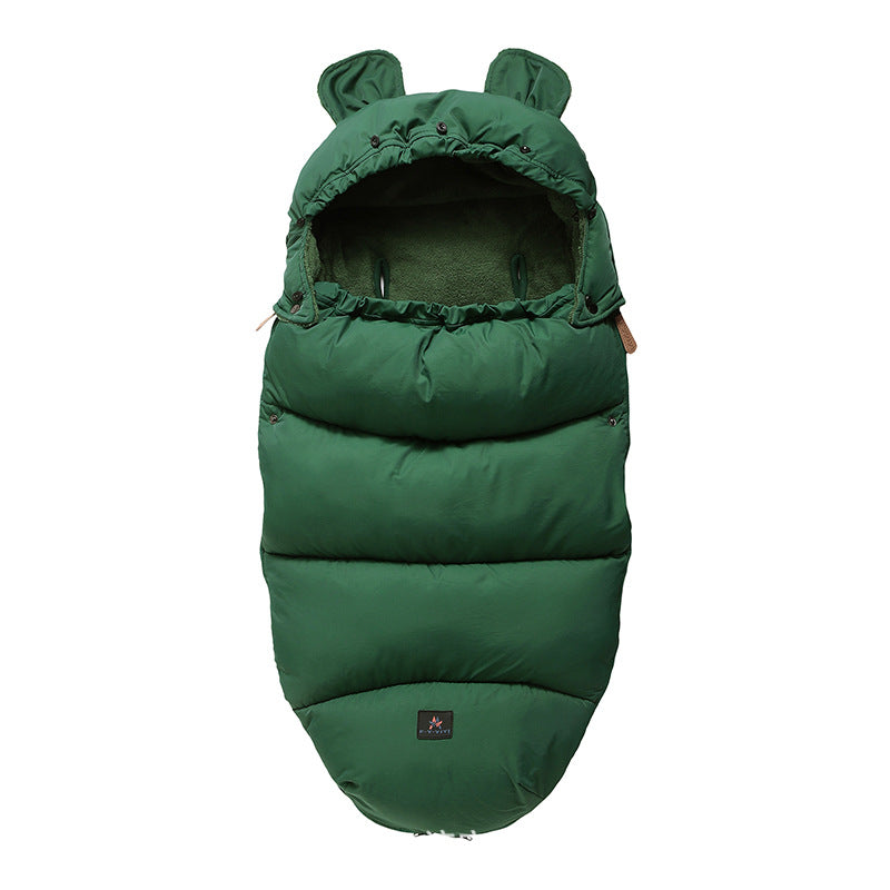 Green baby sleeping bag with bear ears on a white background