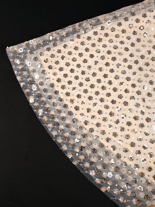 Sequined fabric with a black background