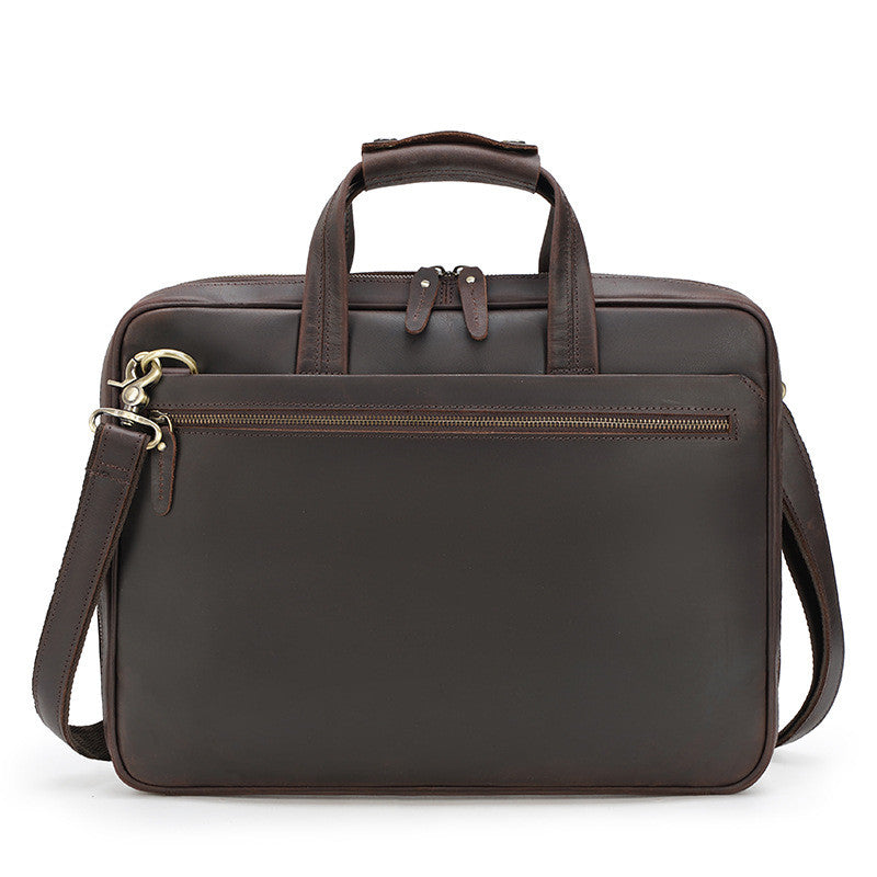 Brown leather briefcase with a shoulder strap on a white background