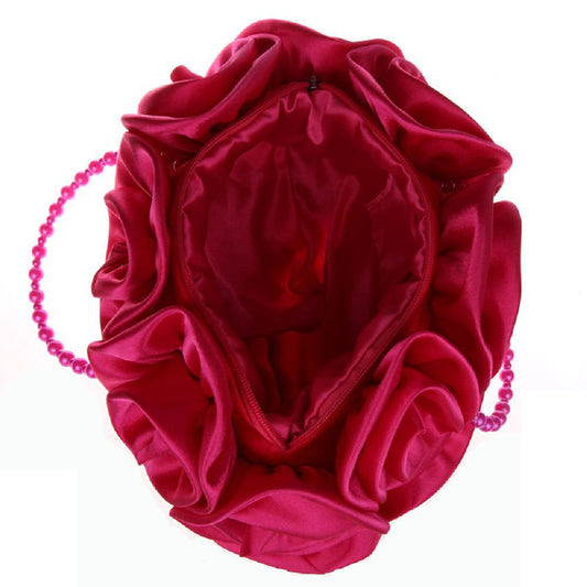 Pink satin hair bun cover with a chain on a white background