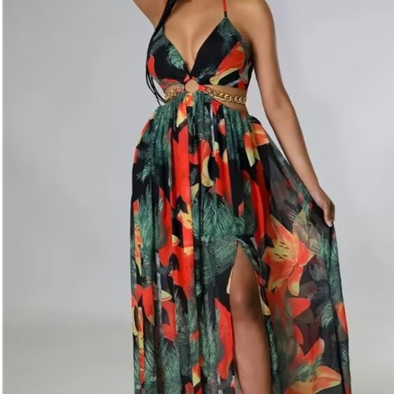 Colorful floral dress with a high slit on a plain background