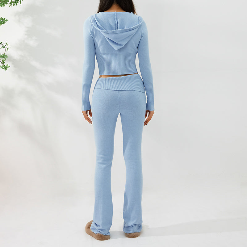 Light blue long-sleeve top and flared pants set on a white background by millivan