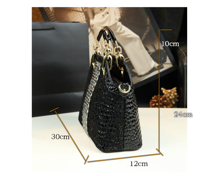 Black handbag with measurements on a white background