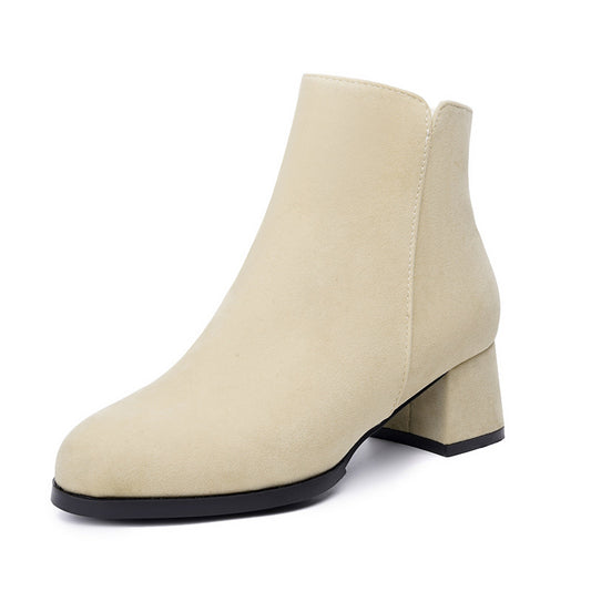 Beige ankle boot with a block heel on a white background