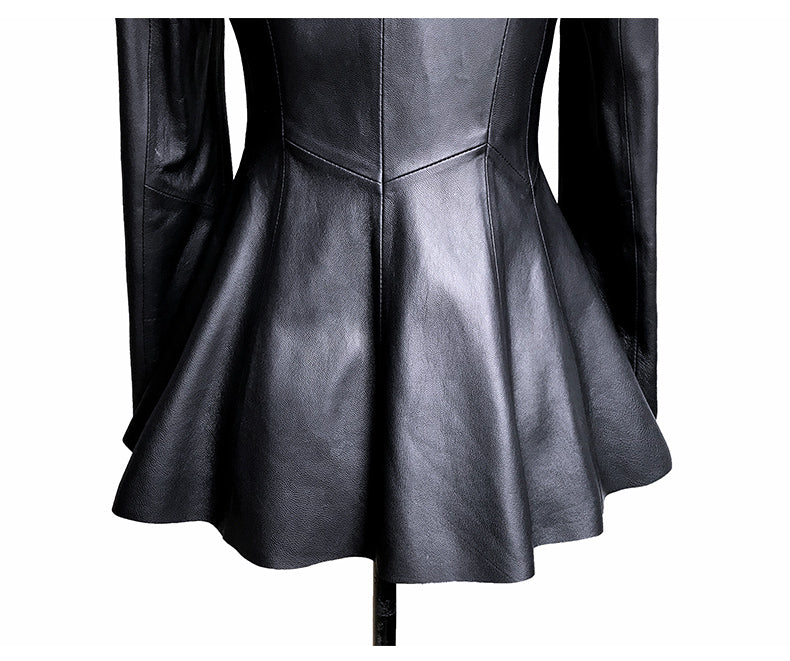 Black leather dress with a fitted bodice and flared skirt on a white background