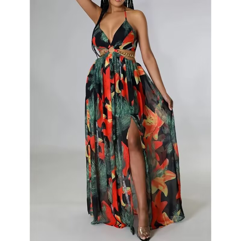 Woman wearing a colorful floral dress with a slit on a gray background