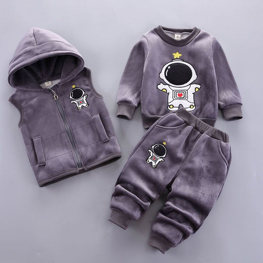 Children's purple outfit with astronaut design on a gray background