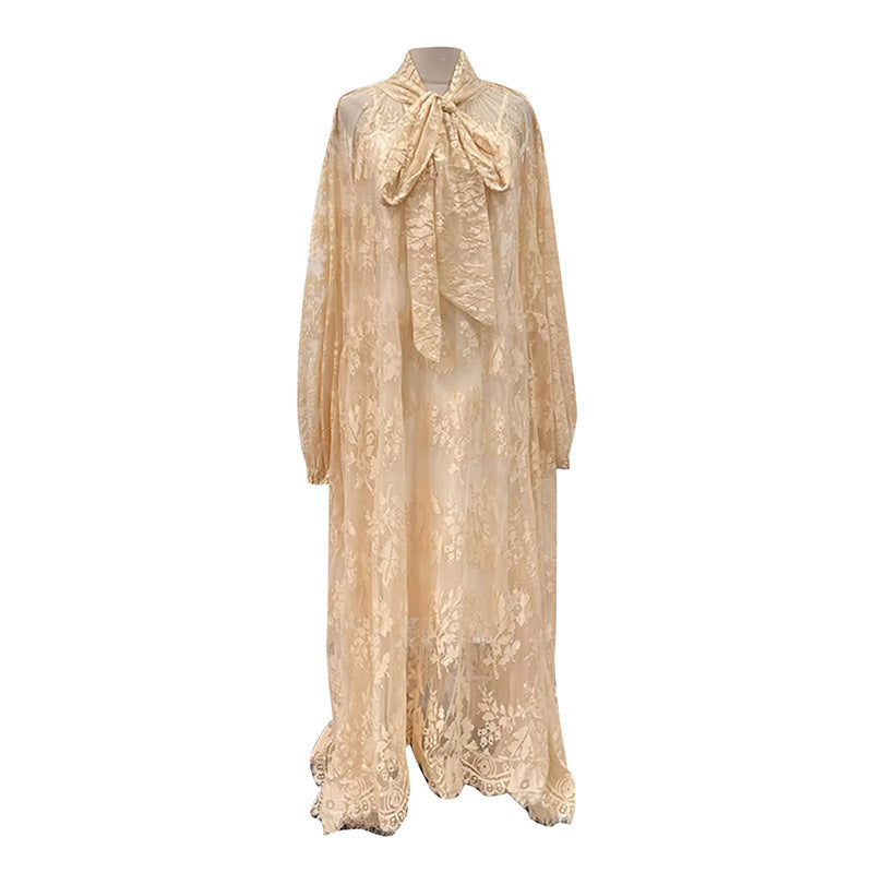 Lace dress on a mannequin against a white background