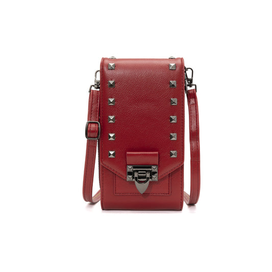 Red leather crossbody bag with studded details on a white background