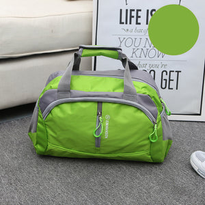 Green and gray duffel bag on a carpeted floor with a partially visible poster in the background.