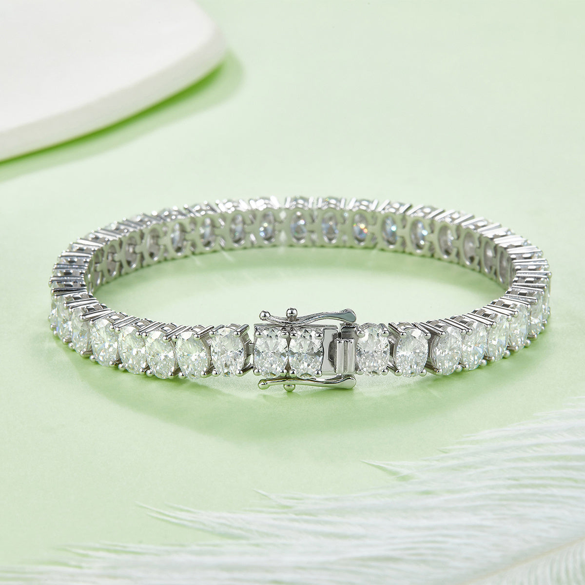 Bracelet Moissanite is a single-row oval cut moissanite tennis bracelet in platinum-plated S925 sterling silver — GRA certified, D Color, VVS1 clarity, and set with precision-cut 6×4mm oval moissanite stones from end to end.