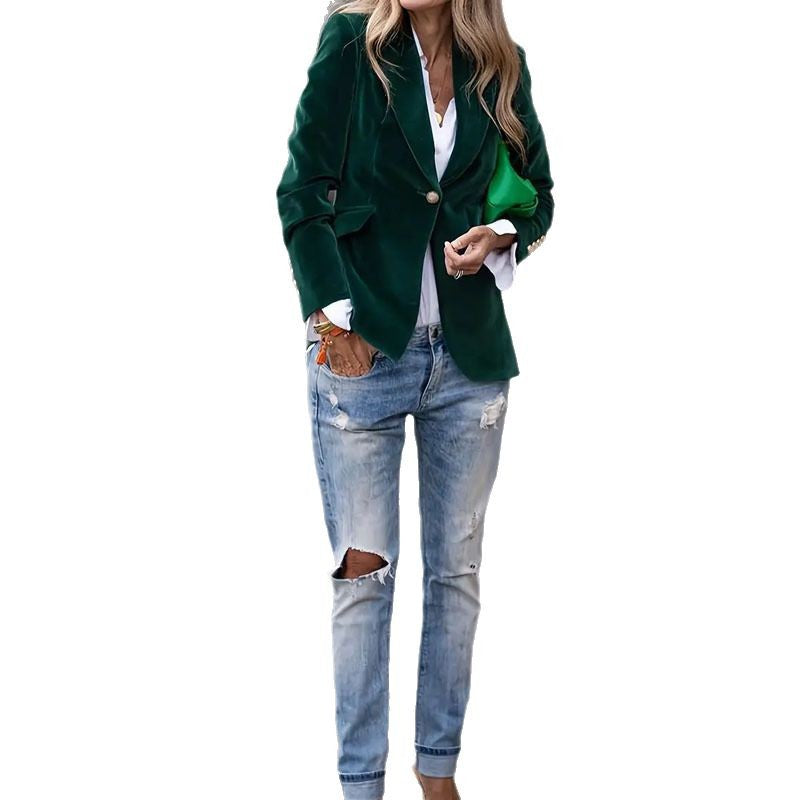 Green blazer worn by a person on a white background