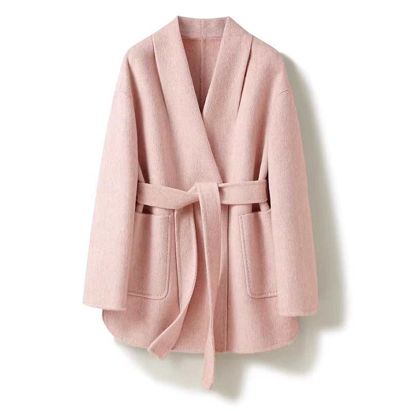 Pink robe-style coat on a white background