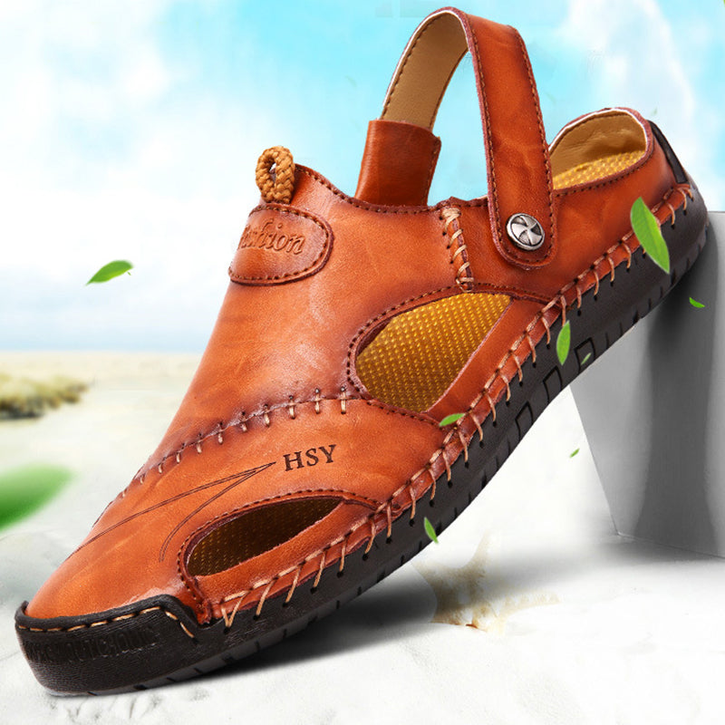 Brown sandal with 'HSY' branding on a blurred natural background