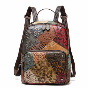Multicolored patchwork backpack with embossed patterns on a white background