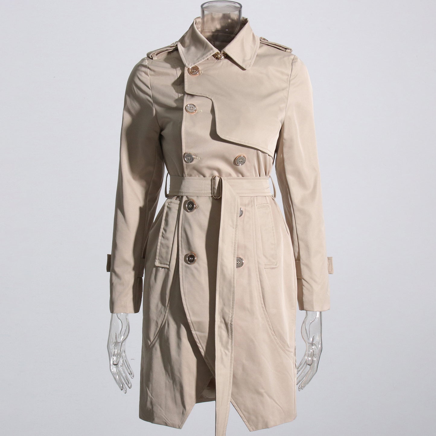 Beige trench coat on a mannequin against a light gray background by millivan
