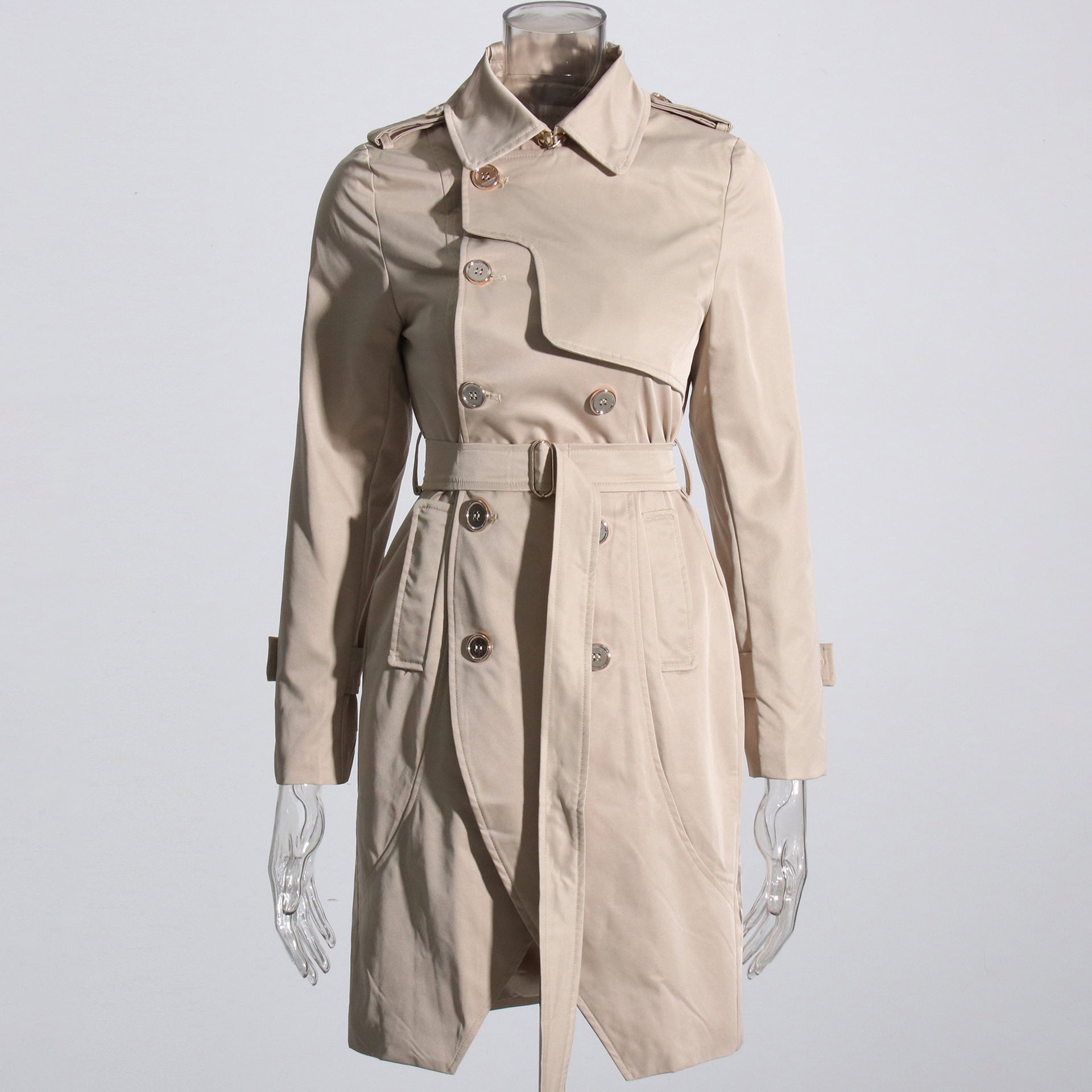 Beige trench coat on a mannequin against a light gray background by millivan