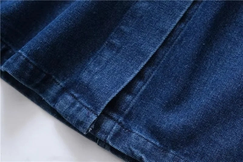 Close-up of blue denim fabric on a white background