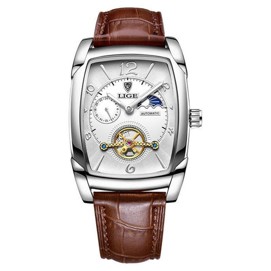 Watch with brown leather strap and silver case on white background