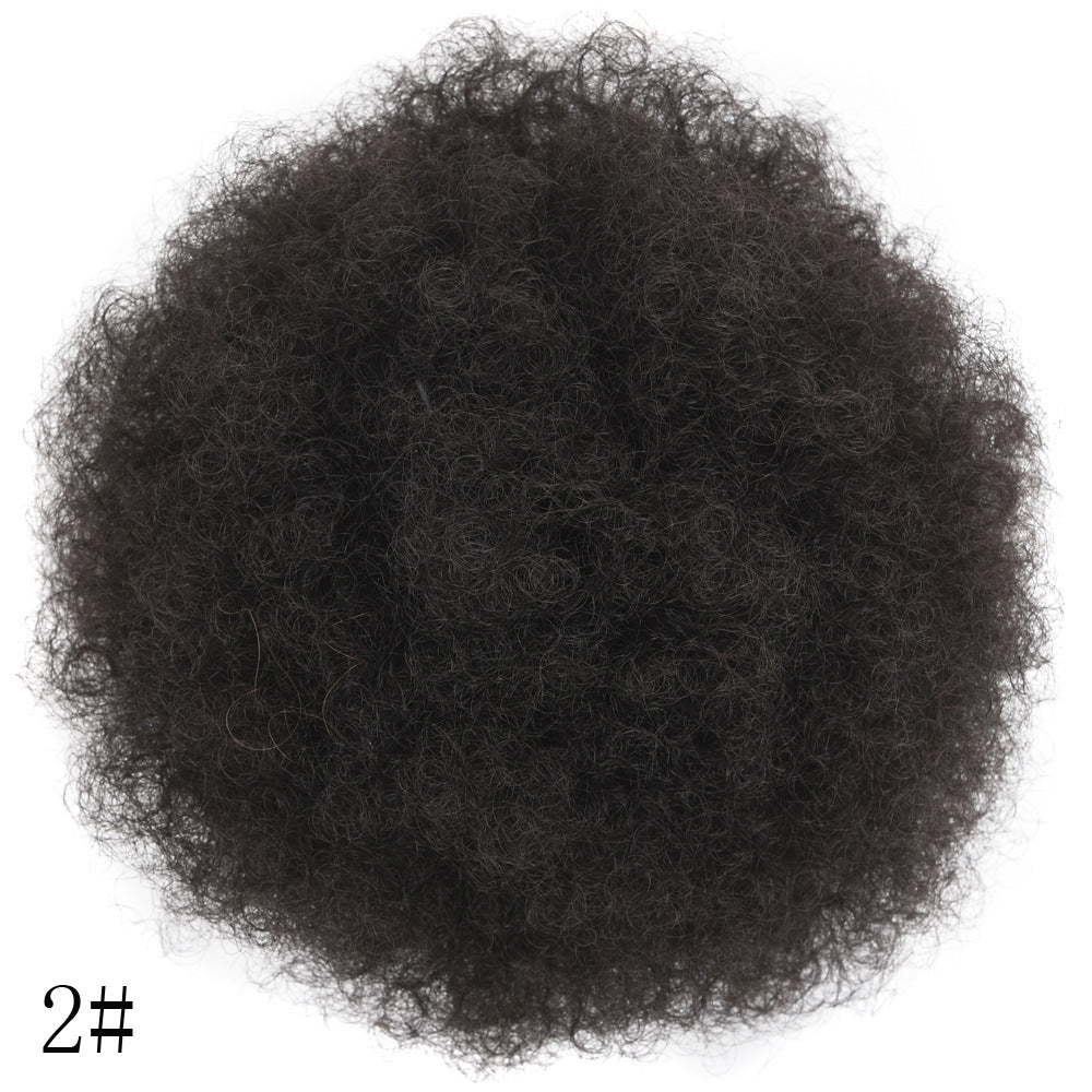 Black synthetic hair bun on a white background