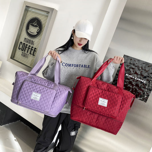 Person holding a purple and a red quilted bag in a room with coffee-themed decor.