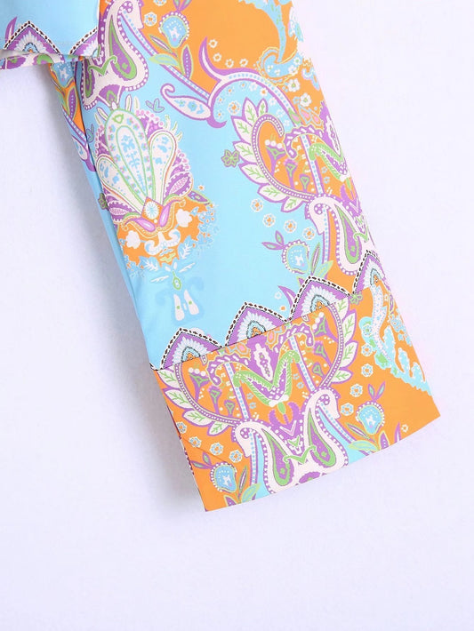 Colorful paisley-patterned fabric on a white background