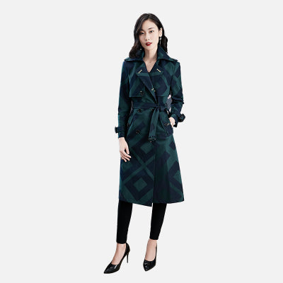 Woman wearing a dark green trench coat on a white background by millivan