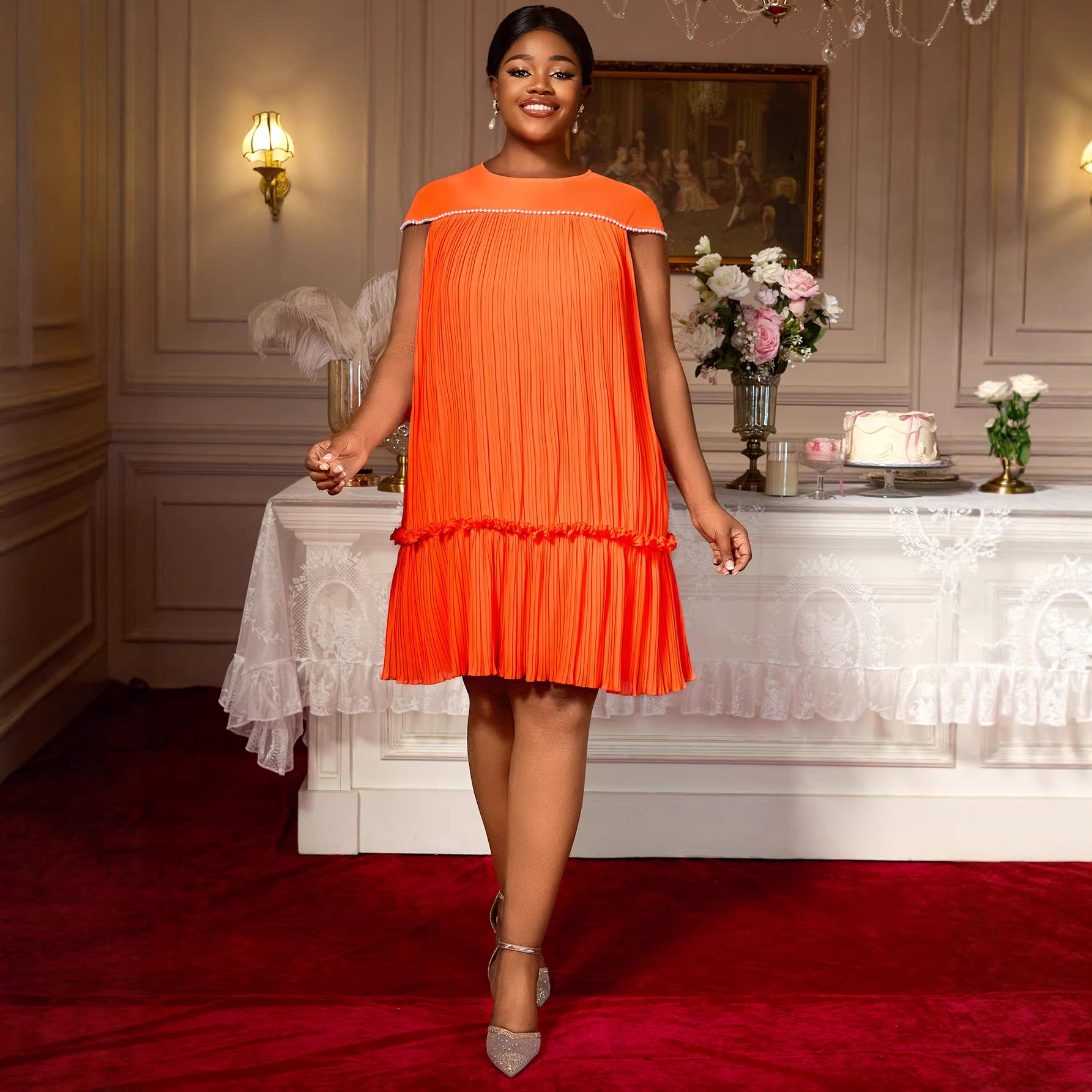 Woman in an orange dress standing in a elegant room with red carpet and white table. by millivan