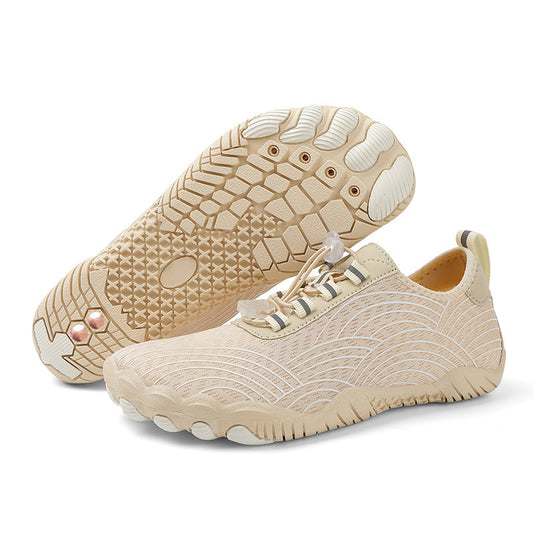 Beige sneakers with textured soles on a white background