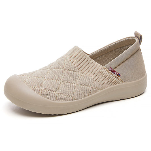 Beige slip-on shoe with textured surface on a white background