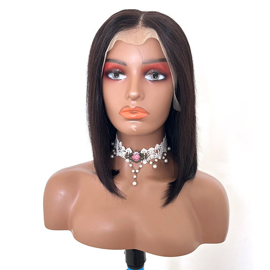 Mannequin head with a black wig on a white background