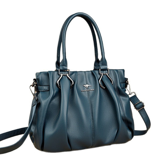 Blue handbag with a visible brand logo on a white background