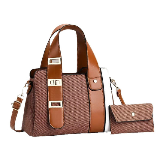 Brown handbag with matching clutch on a white background