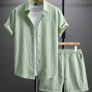 Light green textured shirt and shorts set on a gray background