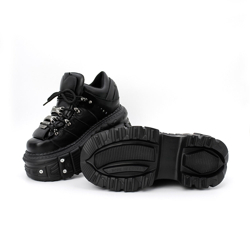 Black platform boots on a white background