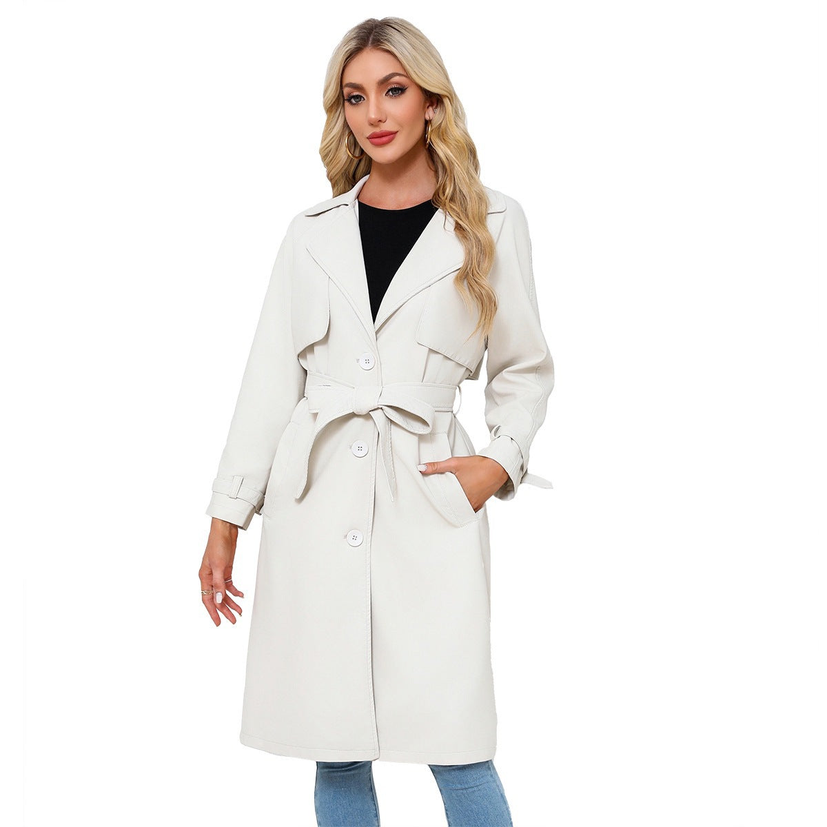 Woman wearing a white trench coat on a white background