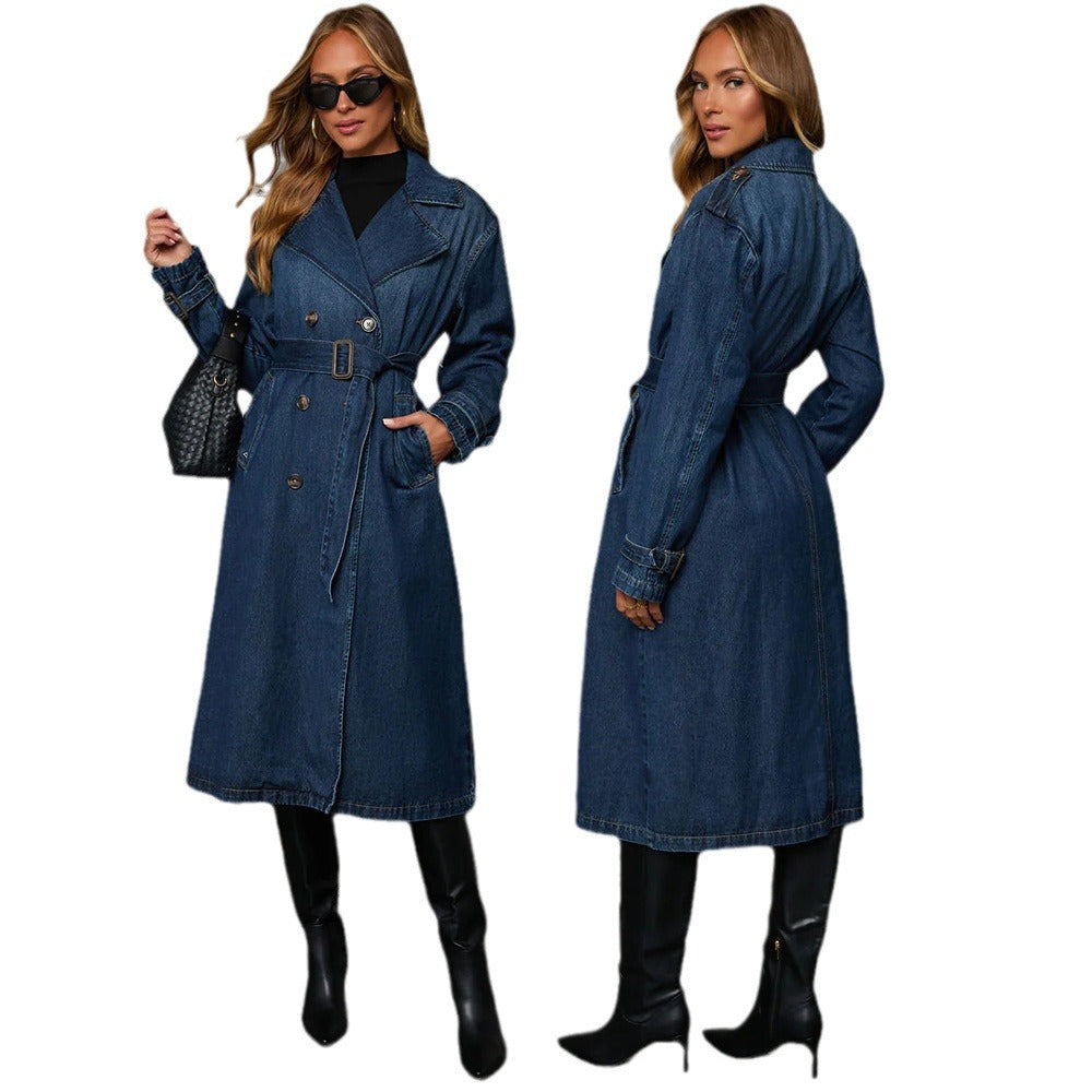 Woman wearing a blue denim coat with black boots on a white background