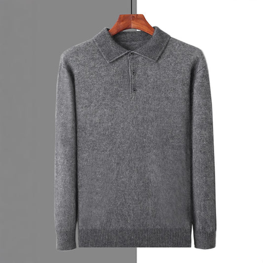 Gray sweater on a hanger against a gray background