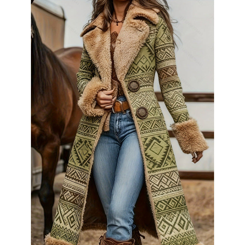 A woman wearing a long patterned coat with a fuzzy beige shearling-style collar and cuffs, paired with blue jeans and brown boots, standing outdoors near a horse.