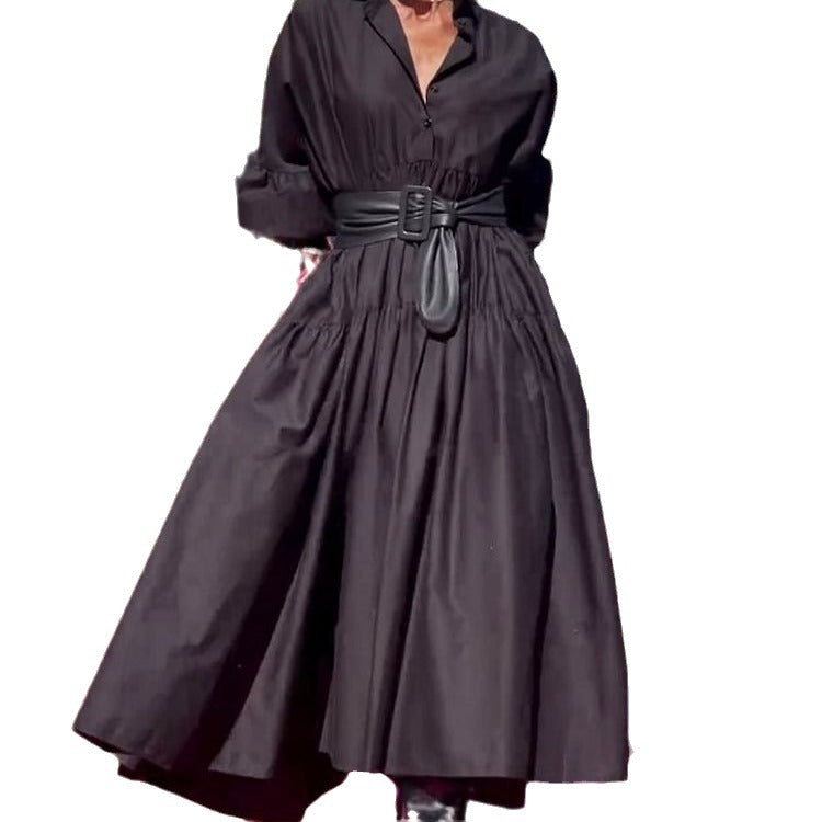 Black dress with a belt on a white background