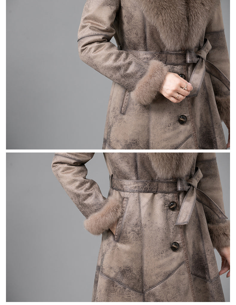 Brown coat with fur trim on a gray background
