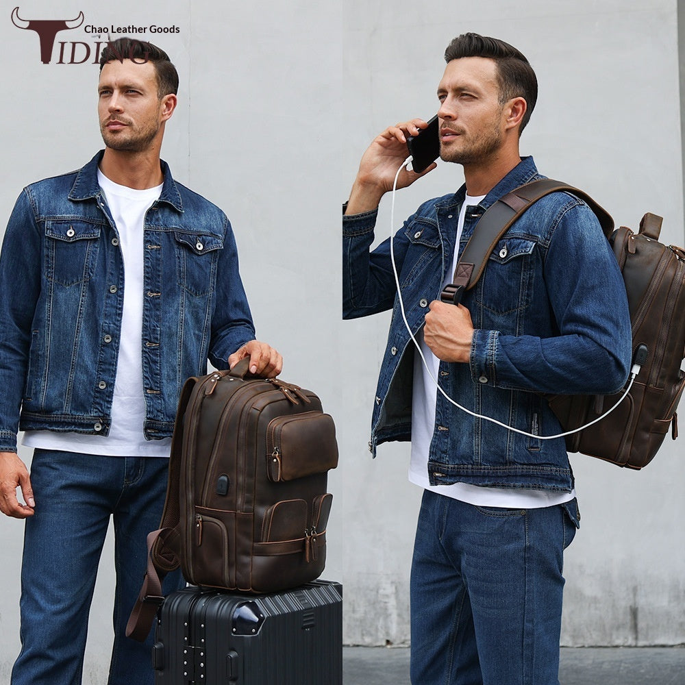 Two men in denim jackets with leather bags and a suitcase, TIDI brand visible.